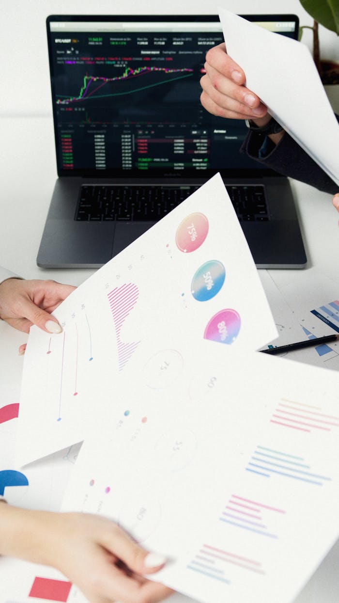 Mastering the First Impression: Your intriguing post title goes here Business professionals reviewing data charts and graphs on laptop.